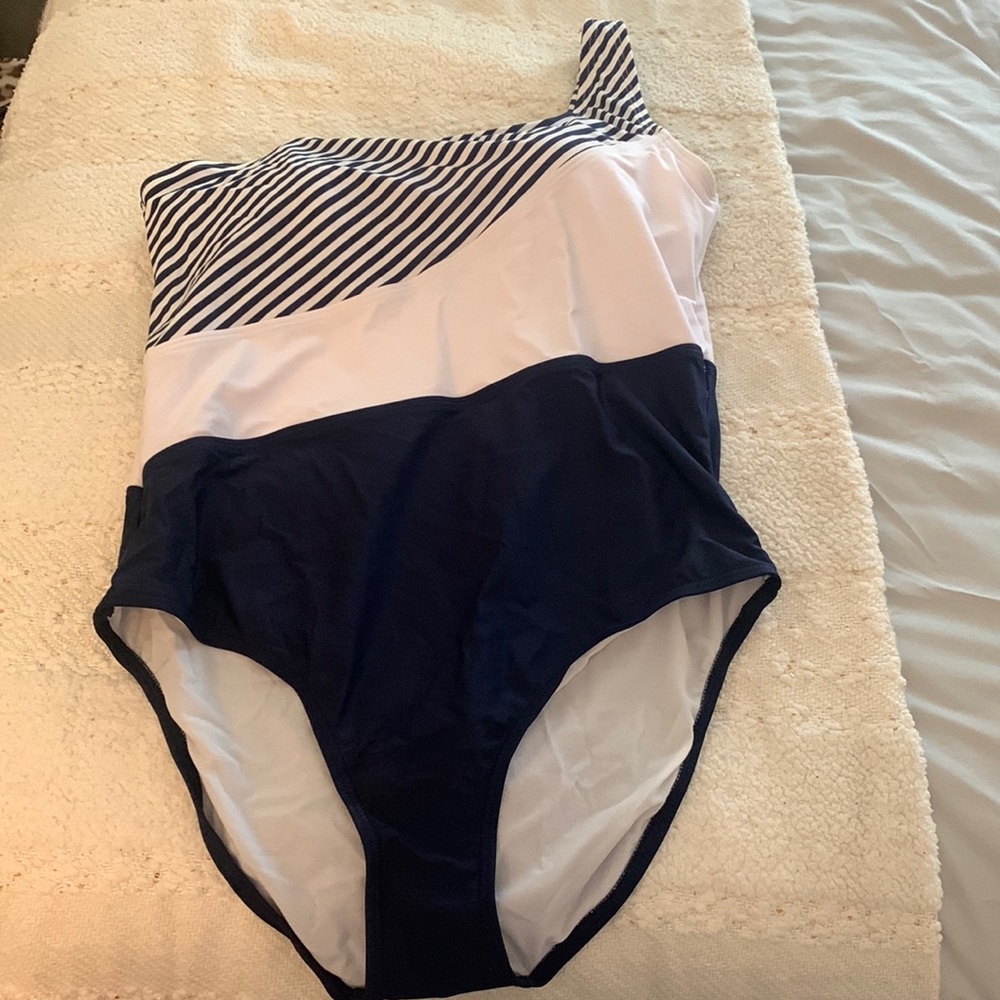 One shoulder navy and white bathing suit